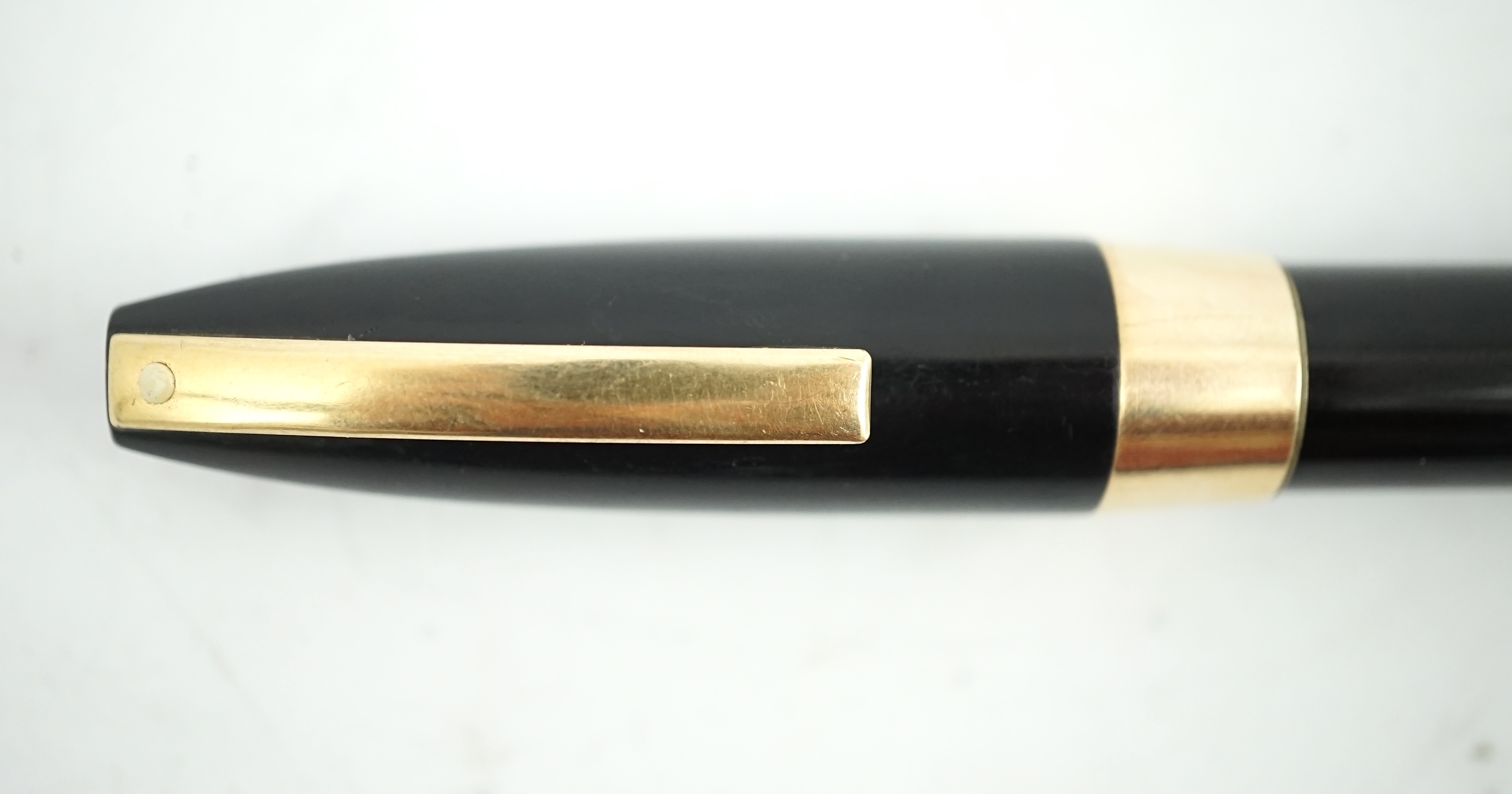 A Sheaffer 'PFM' fountain pen in black gold filled trim